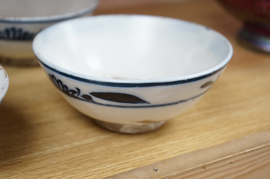 A set of four swatow blue and white pottery bowls, 17cm diameter. Condition - fair